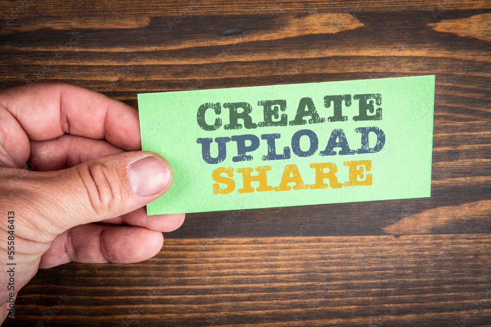 Wall mural create upload share. text on a green piece of paper