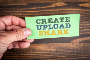 Create Upload Share. Text on a green piece of paper