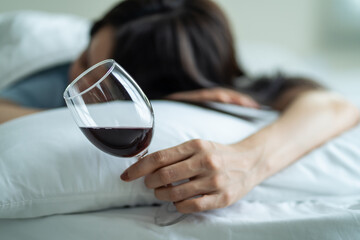Asian young depression woman feeling heart broken and drinking alcohol. 