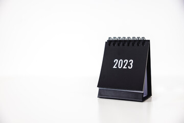 2023 business calendar on office table in new year day. Make a work plan for the start of the year. Concept about Celebration, Business, Christmas, New Year.
