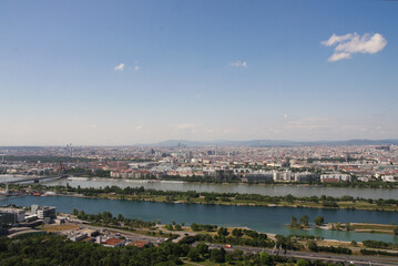Fototapeta premium Aerial panorama of Vienna and the Danube River flowing through it on a sunny summer day, Vienna, Austria.