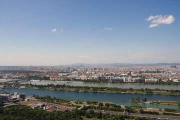 Aerial panorama of Vienna and the Danube River flowing through it on a sunny summer day, Vienna, Austria.