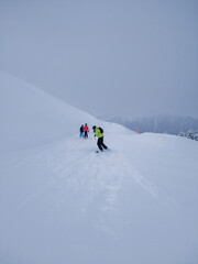 Fototapeta na wymiar Adult snowboarder on a blue (easy) slope