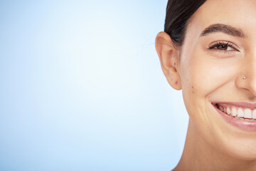 Skincare, beauty and portrait of woman for wellness, dermatology and healthy skin on blue background. Cosmetics, healthcare and face macro of girl on copy space for skincare products, facial and spa