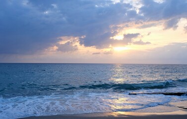 Wave hitting the beach in the sea.