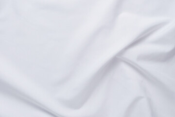 White fabric. luxurious white fabric texture background. Creases of satin, silk and cotton.