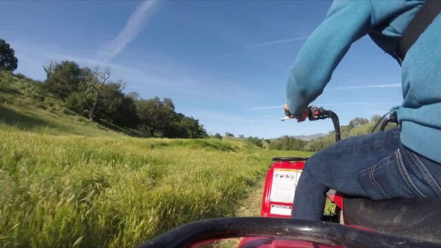 GoPro Shot of ATV Timelapse Riding on Dirt Road in California Green Fields