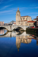 Fototapeta na wymiar View of the Nervion river, San Anton bridge and church of San Anton at Bilbao city, Bilbao