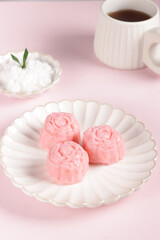 Getuk or Gethuk is traditional food from Central Java, Indonesia, made from mashed cassava and served with grated coconut.