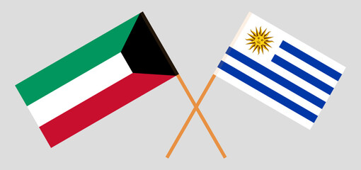 Crossed flags of Kuwait and Uruguay. Official colors. Correct proportion