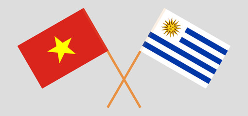 Crossed flags of Vietnam and Uruguay. Official colors. Correct proportion