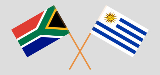 Crossed flags of South Africa and Uruguay. Official colors. Correct proportion