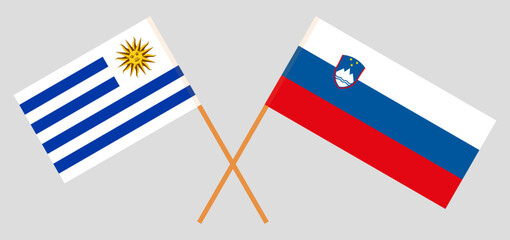 Crossed flags of Uruguay and Slovenia. Official colors. Correct proportion