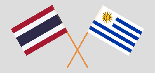Crossed flags of Thailand and Uruguay. Official colors. Correct proportion