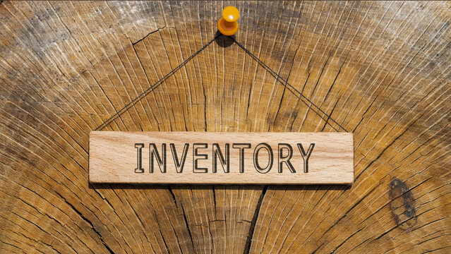 The word Inventroy. Background log written on wooden board