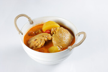 Gaeng Garee is Thai Yellow Curry made from chicken, potatoes and red cherry tomatoes.