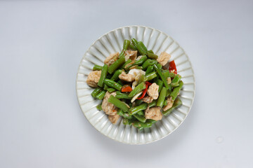 Oseng or Tumis Buncis is stir fry bean with fried tofu.