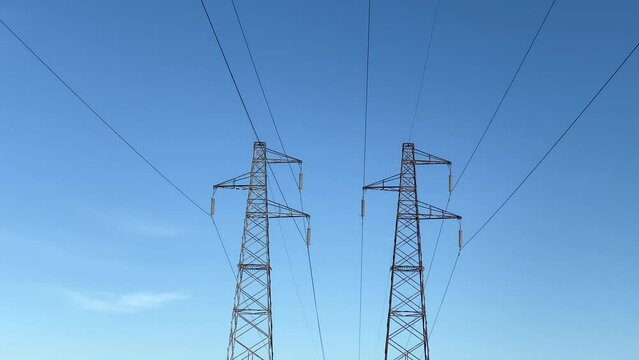 High voltage electricity transmission with power lines and stations located on open fields, intermittent electricity transmission because of bad conditions and crisis in Europe, searching fo