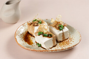 Hiyayakko is Japanese Food made from Chilled Tofu with topping like grated ginger, shallots, bonito flakes and soy sauce.