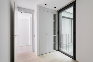 Modern style entrance hall interior, neutral white color corridor with wooden light parquet floor,...
