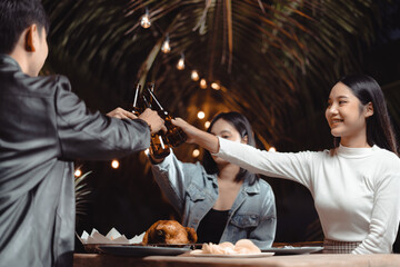 Beautiful girls tanlking and joining in drinking beer at a backyard party..JPG