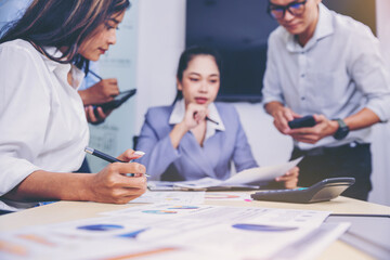 Fototapeta premium Businesspeoples meeting to discuss the situation on business plan, marketing and business result. Selected focus