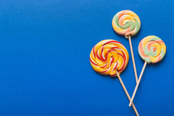 Set of colorful lollipops on colored background. Summer concept. Party Happy Birthday or Minimalist Concept