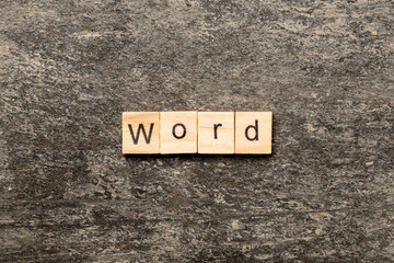 word written on wood block. WORD text on cement table for your desing, concept