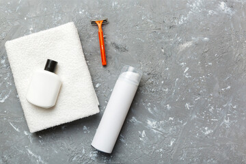 shaving man set. shaving machine, towel, lotion and shaving foam on colored background. Men bath Accessories top view