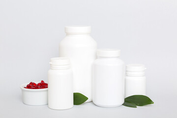 different drugs and health supplement pills with medicine bottle health care and medical top view. Vitamin tablets. Bottle with colored pills on table background. Multivitamins