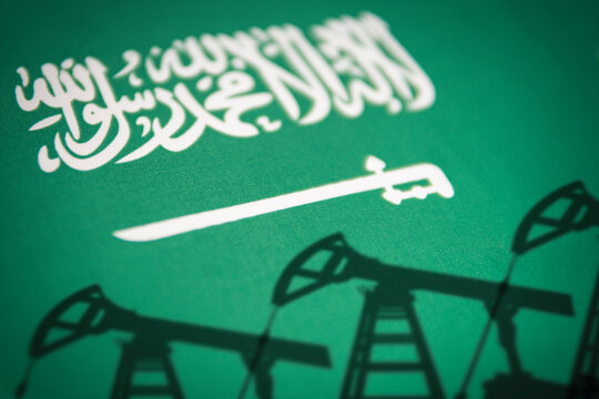 oil industry of saudi arabia. Oil rigs on the background of the saudi arabia flag. Mining and oil export. trading on global fuel market. Fuel industry concept.