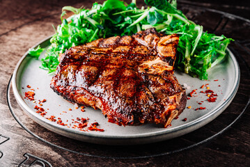 Porterhouse beef steak cooked on a grill on plate