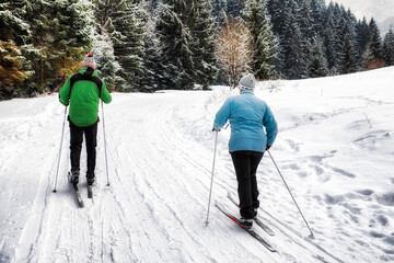 Fototapeta na wymiar Active seniors. Cross-country skiing. Winter sport activities