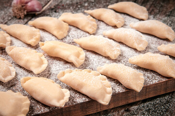 Vareniki (dumplings), pierogi before boiling - traditional Ukrainian food
