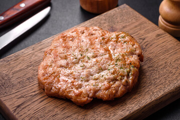 Delicious fresh grilled turkey meat steak with spices and herbs