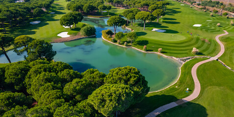 Luxury Green golf course field with lake Antalya Belek Turkey, aerial top view © Parilov