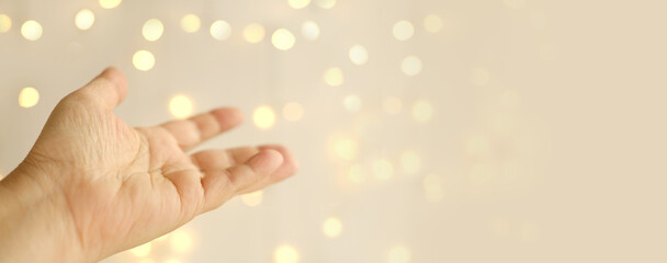 close-up female hand on blurred background with bokeh, gesticulation symbol, allergic itch, concept palm divination, health and predisposition to diseases, scientific research, basis for designer