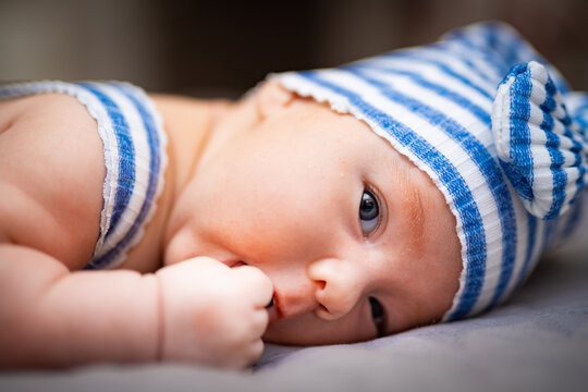 Newborn baby boy in a gnome costume. Baby newborn portrait. First photo shoot.