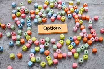 The words OPTIONS written on the post-it note surrounded by colorful cubes