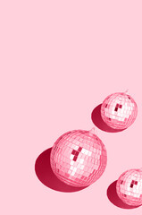 Color of the year 2023 viva magenta..Shiny disco ball. Creative Christmas pattern. 90s retro party time concept. Xmas holiday background. Top view. Flat lay.