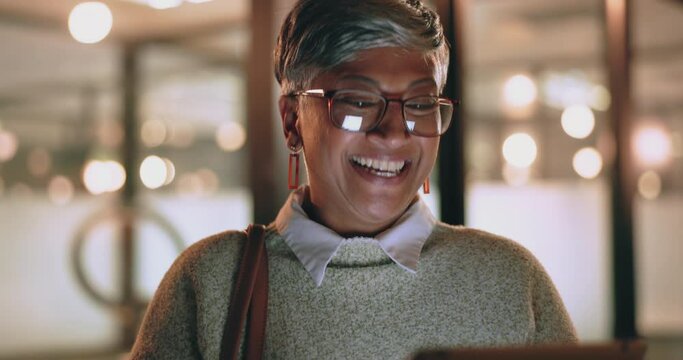 Face, tablet and senior woman in office laughing at funny meme or video at night. Technology, break and happy elderly female with touchscreen on social media reading comic story after working late.