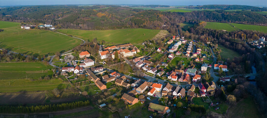 Fototapeta na wymiar Aerial view of the village Svojšín in the Czech Republic on a sunny day in autumn .