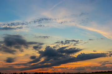 sunset sky with multicolor clouds. Dramatic twilight sky background