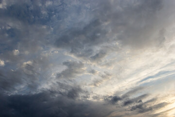 clouds in the sky illuminated by the sun summer evening. background