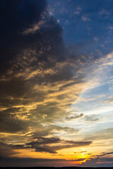Naklejka na ściany i meble sunset sky with multicolor clouds. Dramatic twilight sky background