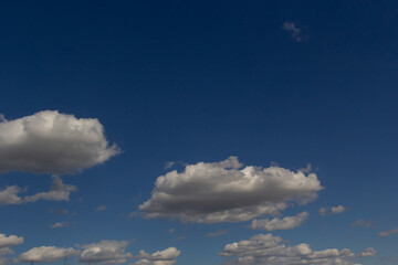 clouds in the sky lit by the sun on a summer day. background
