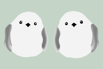 こちらを見つめる2匹のシマエナガ