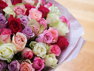 A close-up of a large bouquet of beautiful multicolored roses.