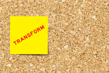 Yellow note paper with word transform on cork board background with copy space