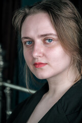 Fototapeta premium Portrait of a young pretty attractive brown-haired girl